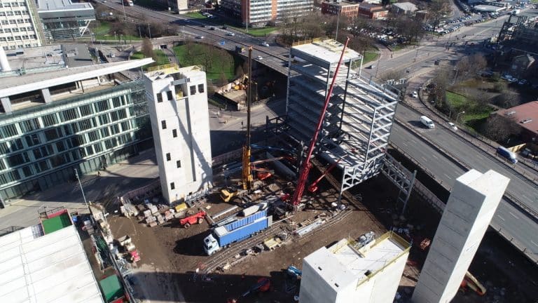 Work begins on steel structure for 16 storey car park and hotel at Manchester’s new city neighbourhood