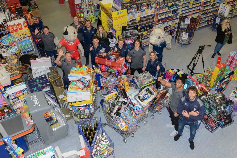 Festive trolley dash raises £5,500-worth of gifts for children in Manchester