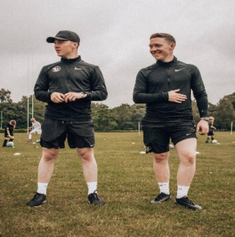 Football coaching twins tackle workshops and receive training of their own