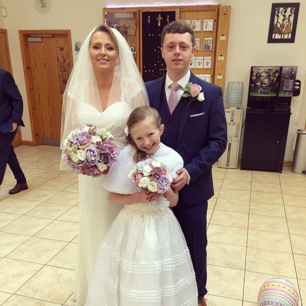 Ruby as a bridesmaid in 2018 with mum Shelley and brother Ryan 1